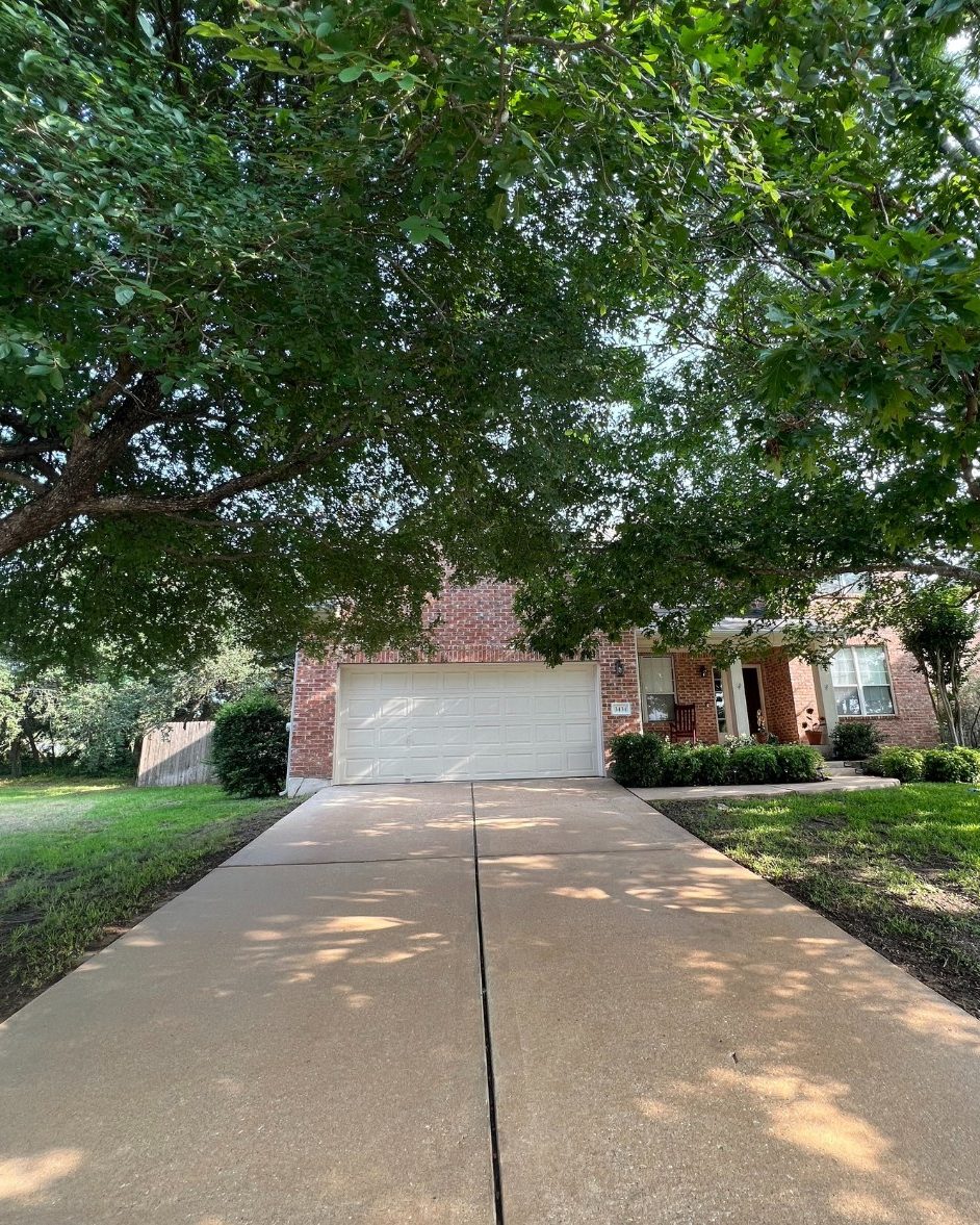 Before and after: concrete driveway pressure washed, Casa Care job (after photo)
