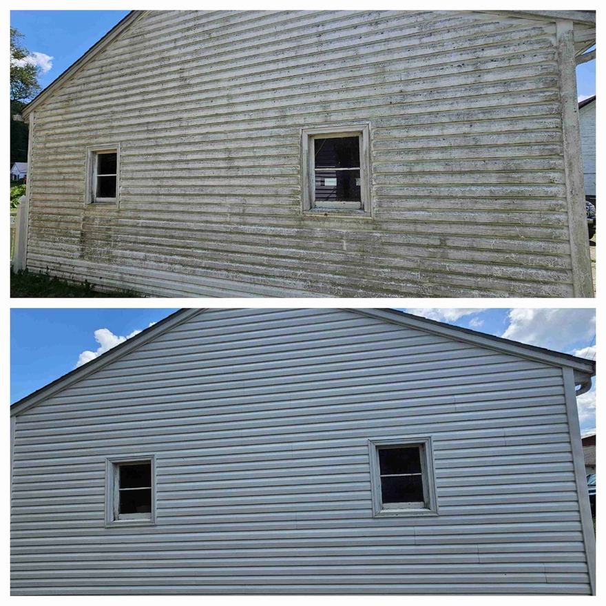 Vinyl siding on a gable wall shown before and after a soft wash: green algae streaks and grime on top, clean light gray siding below